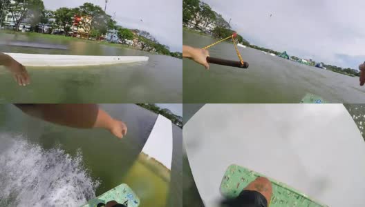 尾流滑板是一种表面水上运动，包括在水面上骑尾流滑板。高清在线视频素材下载