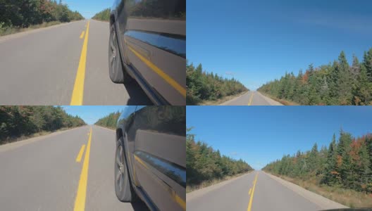 特写:越野车沿着空旷的高速公路通过加拿大的边远地区高清在线视频素材下载