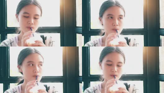 小女孩用吸管喝水高清在线视频素材下载