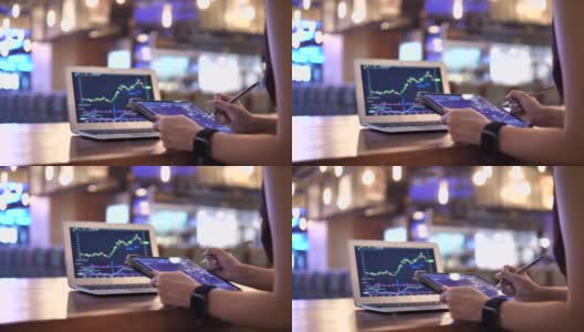 近距离女商人分析股票市场数据和工作在数字平板电脑高清在线视频素材下载
