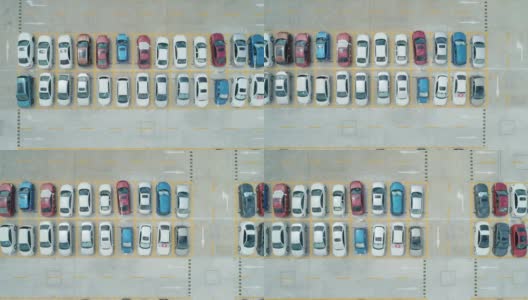 从空中俯瞰，停车场里停满了不同颜色的汽车。相机移动离开高清在线视频素材下载