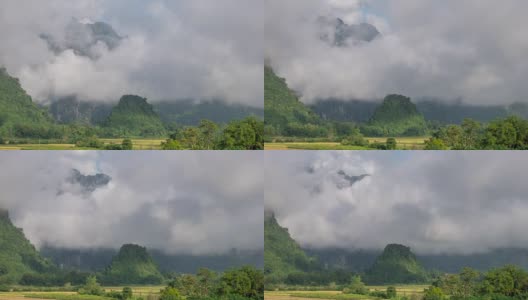 4K延时:美丽的雾在日出移动在万荣，老挝的视点。高清在线视频素材下载