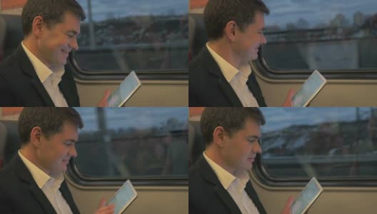 火车上的男人嘲笑平板电脑高清在线视频素材下载