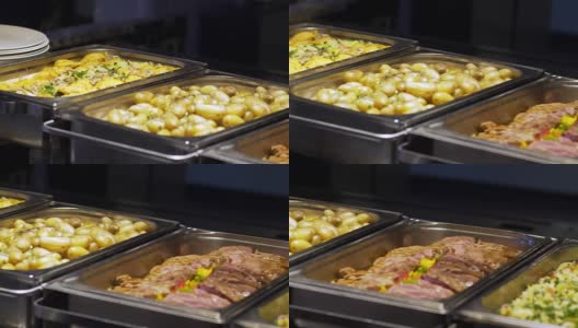 餐厅的客人从自助餐中选择食物高清在线视频素材下载