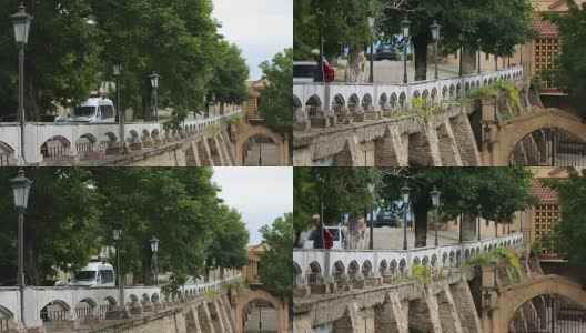 Cars and people on ancient stone bridge in Georgia, sightseeing architecture高清在线视频素材下载