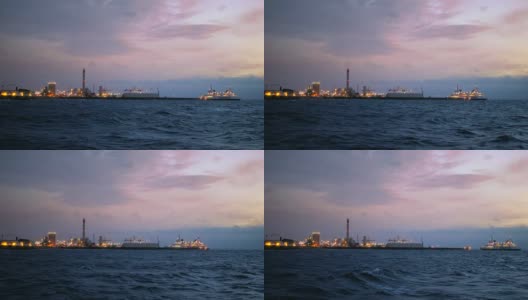渡船抵达瑞典赫尔辛堡港。黄昏时分的工业建筑高清在线视频素材下载