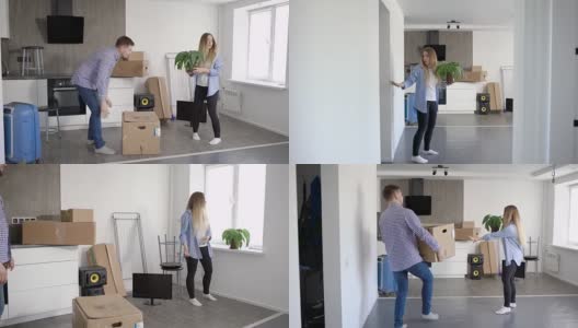 一对幸福的年轻夫妇搬进了新公寓把所有的箱子和东西都搬了进来高清在线视频素材下载