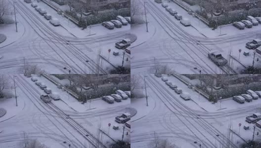鸟瞰图四路交通流在寒冷暴风雪雪天高清在线视频素材下载