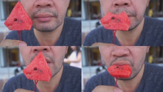 成熟的商人在吃红西瓜高清在线视频素材下载