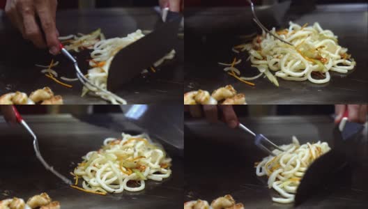 厨师烹制黄油乌冬面烧烤铁板烧高清在线视频素材下载