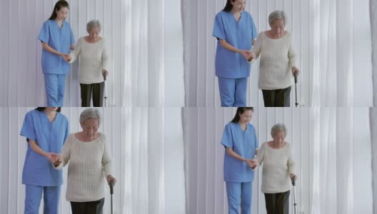 亚洲女性护理人员，帮助亚洲老年妇女在家或医院步行训练和康复过程。老祖母倾听照顾者给予的支持，老年人医疗保健，物理治疗高清在线视频素材下载