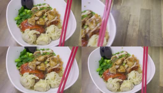 手端馄饨面，泰国街头小吃。高清在线视频素材下载