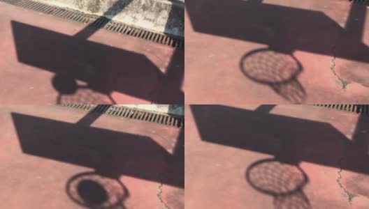 球穿过篮球框的影子高清在线视频素材下载