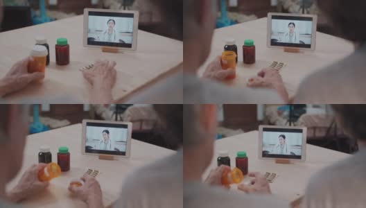 在远程医疗预约中使用数字平板电脑与女医生进行远程医疗交流的亚洲老年家庭高清在线视频素材下载