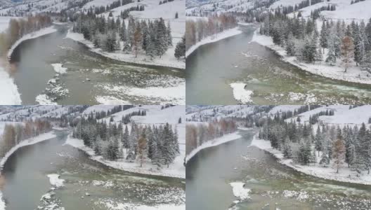 森林里下了一整夜的雪，森林变成了梦幻般的雾凇，河流仍然穿过它高清在线视频素材下载