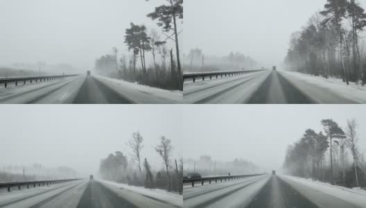 在大雪纷飞的冬天，通过高速公路上的汽车和卡车的挡风玻璃观看高清在线视频素材下载