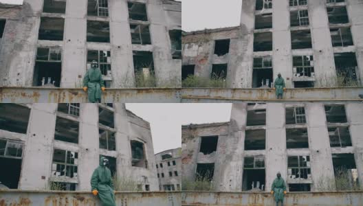 核化学事故幸存者。一名戴防毒面具的男子在废弃建筑附近高清在线视频素材下载