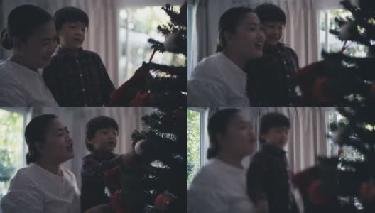 家人装饰圣诞树高清在线视频素材下载