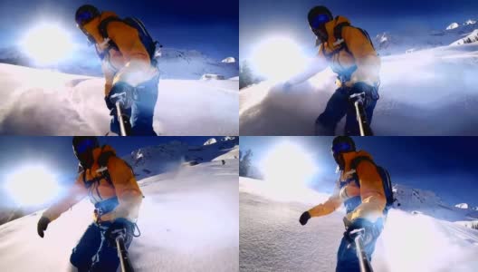 手持自拍杆，骑着滑雪板的男子高清在线视频素材下载