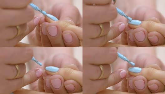 在女性指甲上涂指甲油的过程。高清在线视频素材下载