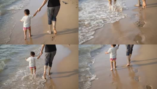 小男孩和妈妈在海滩上休息。高清在线视频素材下载
