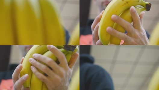 男手在超市挑选香蕉。一个男人从杂货店的柜台上拿着一串香蕉。小伙子正在商店的农产品部挑选新鲜水果。买家选择食物。近距离高清在线视频素材下载
