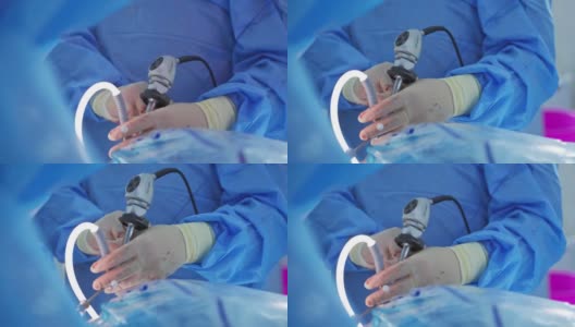 在医院进行腹腔镜手术。腹腔镜腹部手术中外科医生的手高清在线视频素材下载