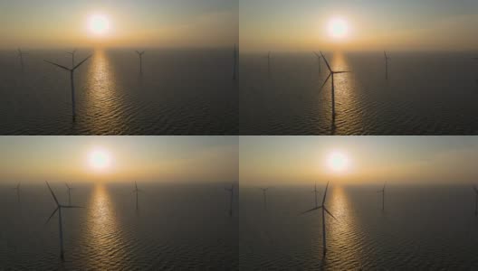 风力涡轮机在清晨，风车公园在荷兰。从空中看风力涡轮机，无人机在windpark westermeerdijk的一个风车农场在IJsselmeer湖最大的荷兰高清在线视频素材下载