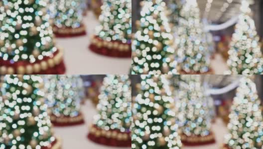 一棵挂着许多灯泡的圣诞树挂在室内。这些是用来做圣诞装饰的。从底部向顶部倾斜射击。的焦点。高清在线视频素材下载