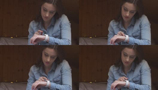 女人使用smartwatch高清在线视频素材下载