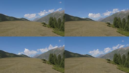 随着时间的推移，青山、夏季草地和山谷高地上的绿色田野逐渐消失高清在线视频素材下载