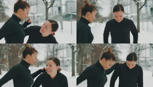 两个女人在雪地里锻炼高清在线视频素材下载