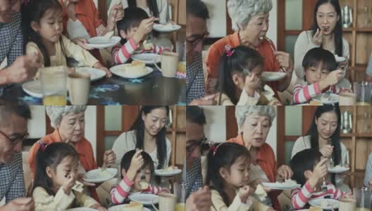 几代同堂的中国家庭在享受生日蛋糕高清在线视频素材下载
