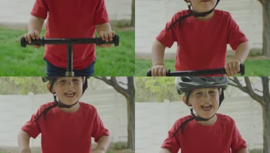 一个可爱的三岁白人男孩戴着自行车头盔，站在他的自行车旁边，在户外笑高清在线视频素材下载