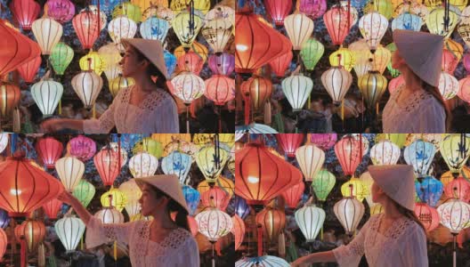 在越南会安，亚洲女人选择灯笼旅行高清在线视频素材下载
