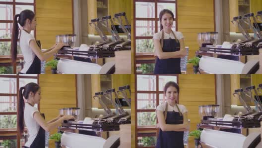 年轻微笑的亚洲女性咖啡师或女性咖啡所有者使用咖啡机，并在咖啡店咖啡厅看着镜头高清在线视频素材下载