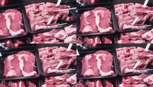 新鲜的牛肉在市场柜台，肉店。展示新鲜切开的牛肉或猪肉。高清在线视频素材下载
