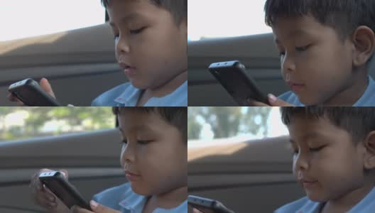 boy play phone in car高清在线视频素材下载