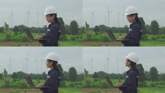 在泰国风电场，检查工程师正在用笔记本电脑准备和检查风力涡轮机的进度。高清在线视频素材下载