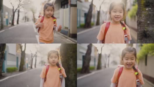 小日本女学生在住宅区樱花树下步行上学高清在线视频素材下载