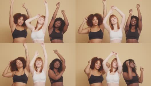 混合种族的妇女用慢动作举起双手跳舞高清在线视频素材下载