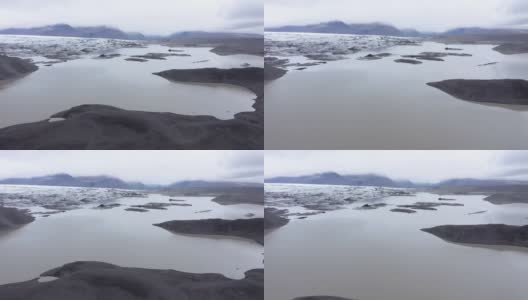 飞越冰岛瓦特纳冰川国家公园斯维纳菲斯冰川湖融化的冰山。全球变暖与气候变化环境概念高清在线视频素材下载