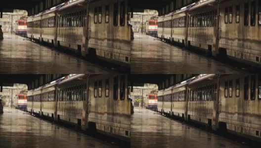 车站站台潮湿，列车车厢站在机车移动的背景下高清在线视频素材下载