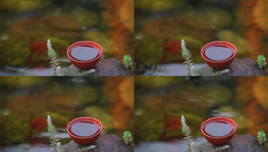 中国红茶与奔流的河流背景高清在线视频素材下载