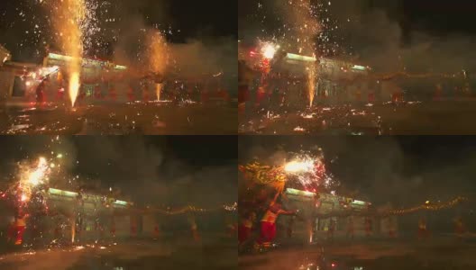 在中国农历新年的晚上，舞龙和烟花表演。高清在线视频素材下载