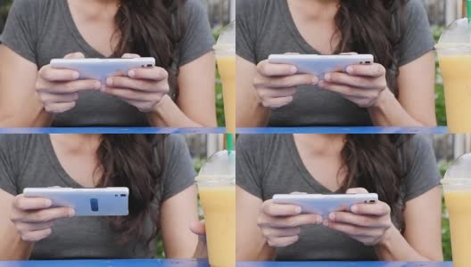 女性用手在触屏智能手机上发短信或打字。水平，美丽的女人在城市里用智能手机发短信高清在线视频素材下载