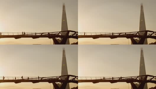 清晨，泰晤士河和千年大桥上的日出高清在线视频素材下载
