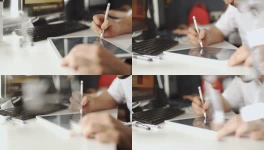 图形设计师工作与交互式笔显示，数字绘图板和笔在电脑上。平滑的跟踪拍摄与漂亮的背光镜头。20年代FullHD高清在线视频素材下载