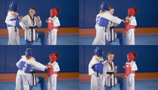 跆拳道老师和穿着防护服的女孩高清在线视频素材下载
