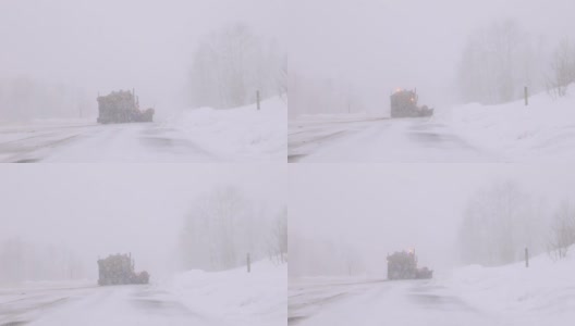 扫雪机在暴风雪中行驶的慢动作高清在线视频素材下载